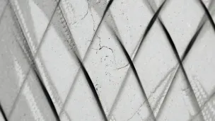White translucent panels arranged in overlapping diamond pattern creating geometric shadows